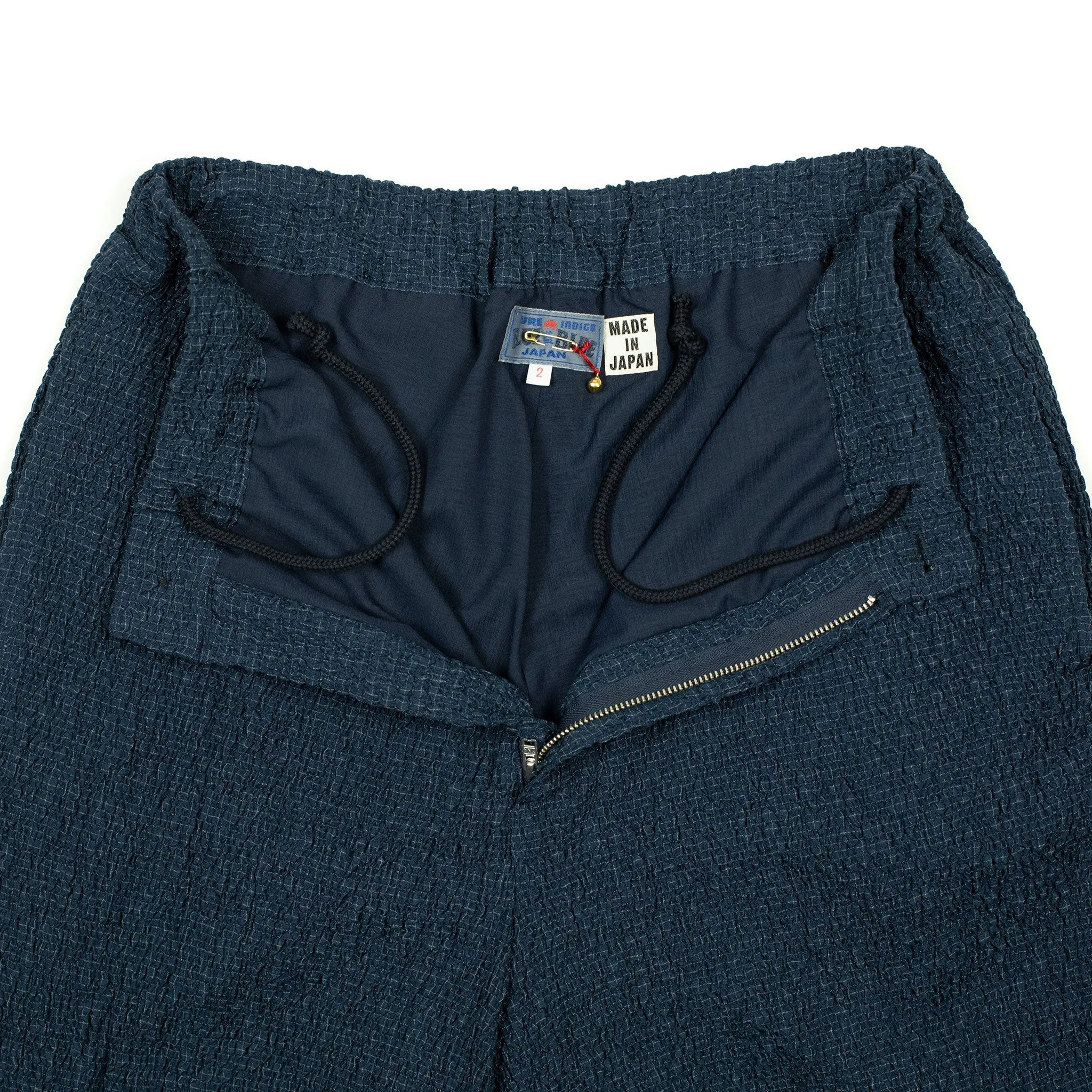 Drawstring trousers in shirred indigo-dyed cupro